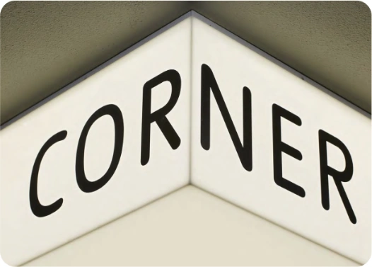 Corner exterior illuminated sign.